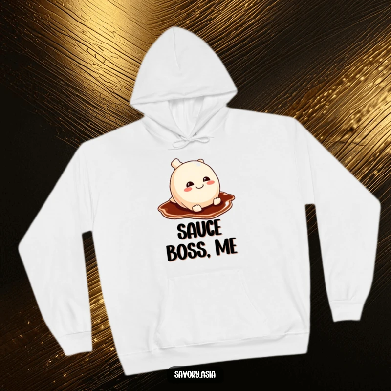Funny potsticker hoodie showing a mischievous potsticker sliding gleefully on a soy sauce puddle, capturing playful, cozy vibes.